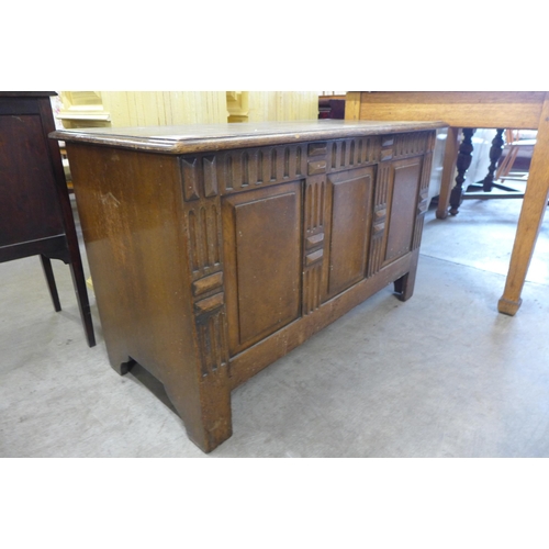 152 - An 18th Century style carved oak blanket box