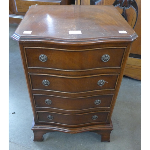 163 - A small mahogany serpentine chest of drawers