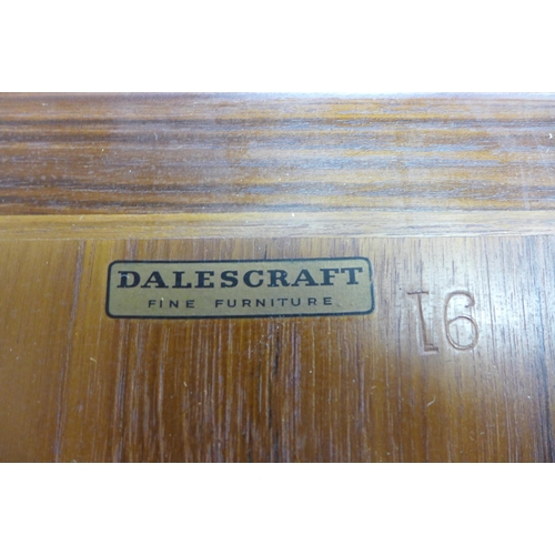 17 - A Dalescraft teak extending dining table and four chairs, designed by Malcolm Walker