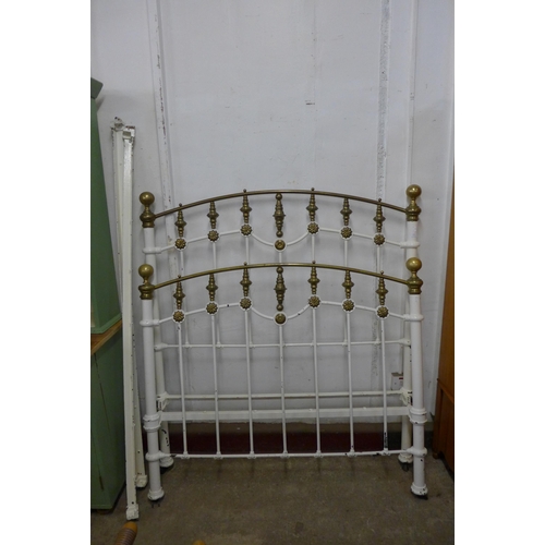 173 - A Victorian painted cast iron and brass double bed