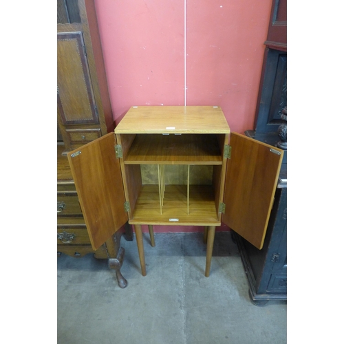 19 - A teak two door record cabinet