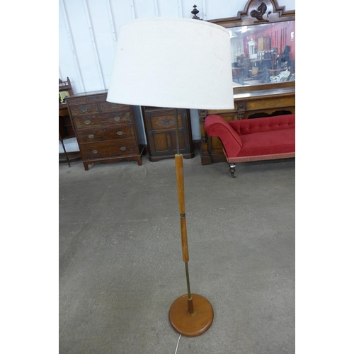 20 - A teak standard lamp