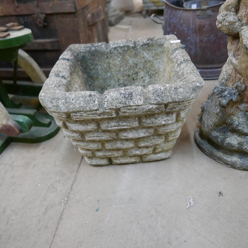 219 - A pair of concrete garden planters and a bird bath