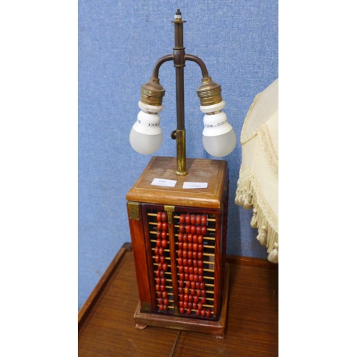 230 - An abacus based table lamp and gilt table lamp