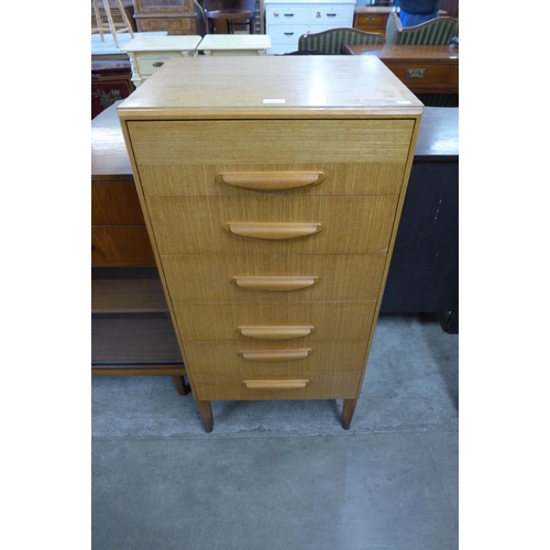 25 - A teak chest of drawers