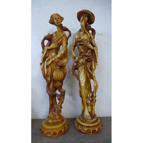 283 - A pair of Asian resin figures