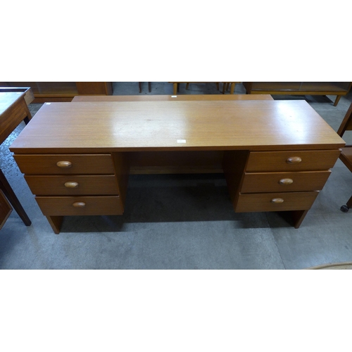 29 - An Austin Suite teak desk