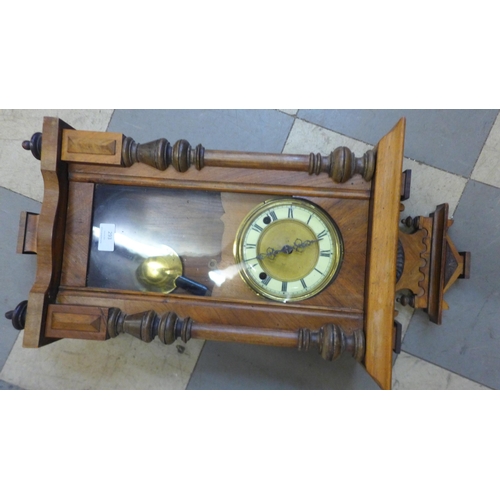 293 - A 19th Century walnut Vienna wall clock