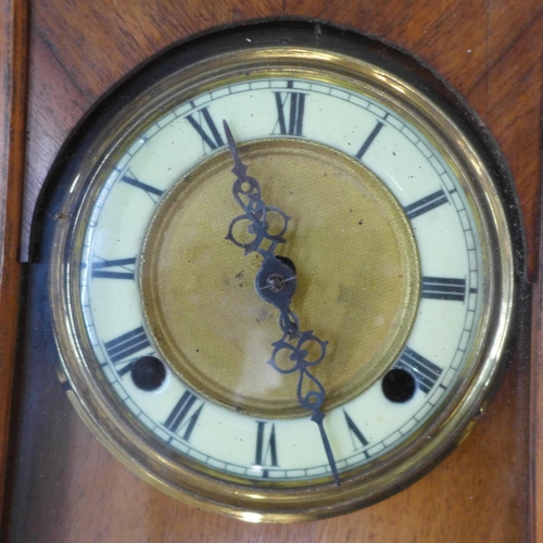 293 - A 19th Century walnut Vienna wall clock