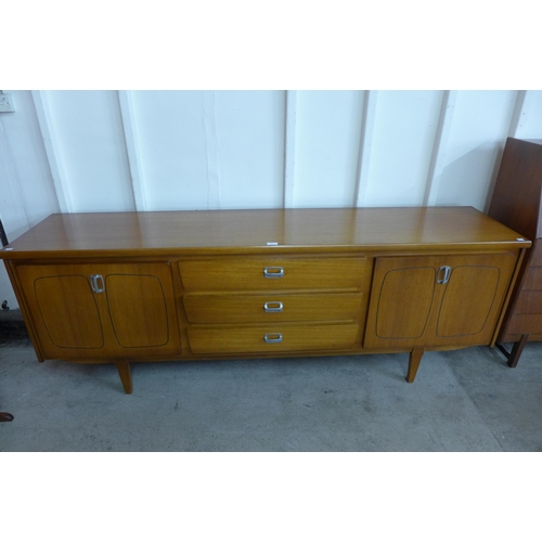 31 - A teak sideboard