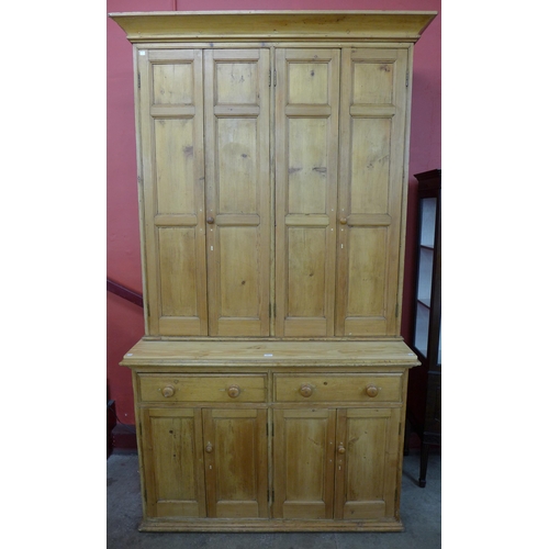 40 - A Victorian waxed pine housekeepers cupboard, 250cms h, 140cms w, 68cms d