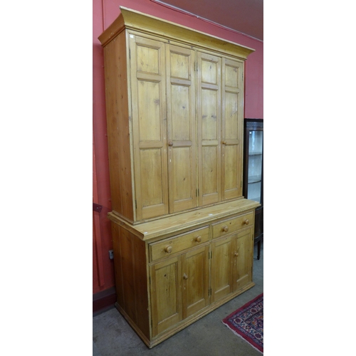 40 - A Victorian waxed pine housekeepers cupboard, 250cms h, 140cms w, 68cms d