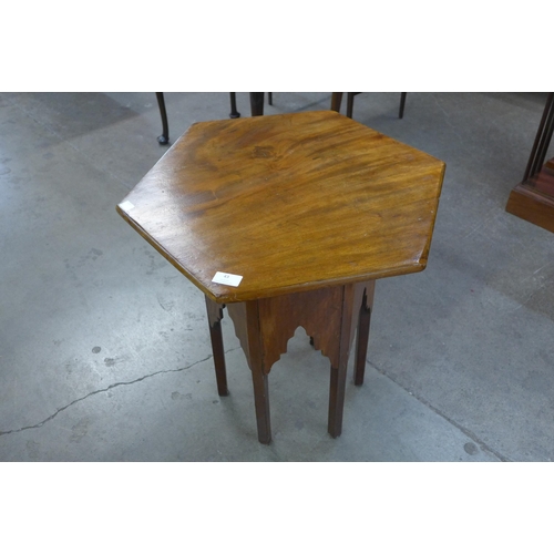 43 - An Arts and Crafts Moorish walnut hexagonal occasional table