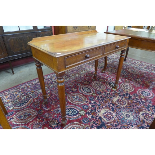 44 - A Victorian mahogany two drawer writing table