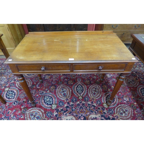 44 - A Victorian mahogany two drawer writing table