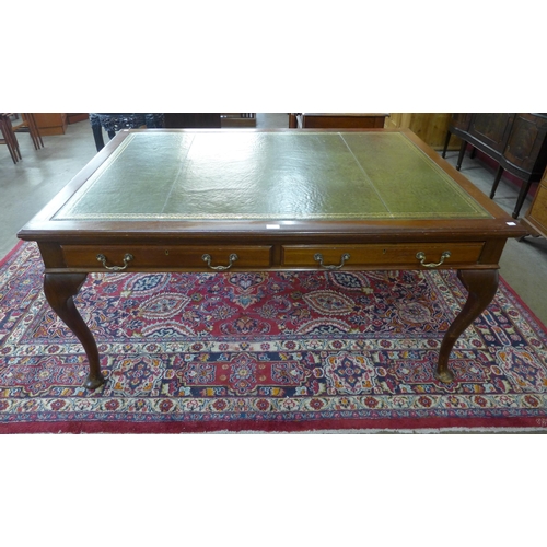 45 - A late Victorian mahogany and green leather topped two drawer library desk