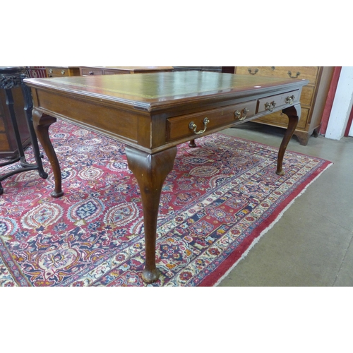 45 - A late Victorian mahogany and green leather topped two drawer library desk