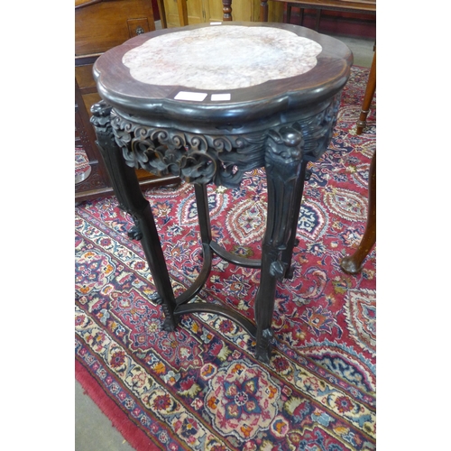 46 - A late 19th/early 20th Century Chinese carved padouk wood and marble topped jardiniere stand