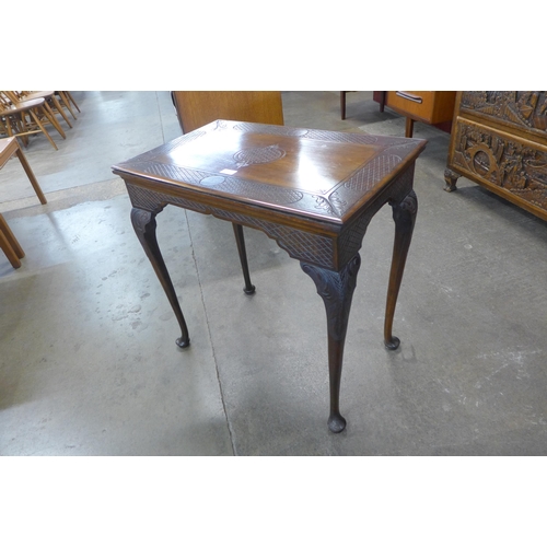 51 - A George II carved mahogany side table