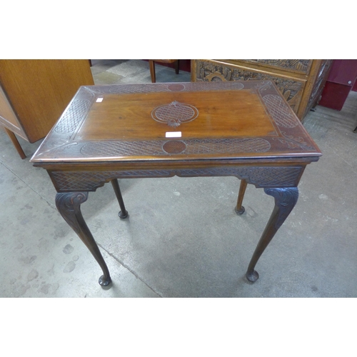 51 - A George II carved mahogany side table