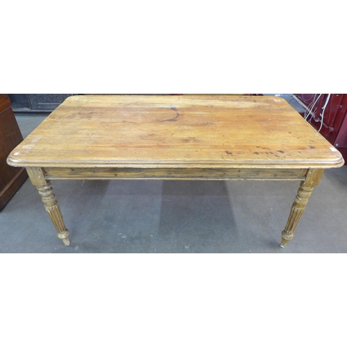 54 - A Victorian style waxed pine farmhouse kitchen table, 71cms h, 171cms l, 103cms w