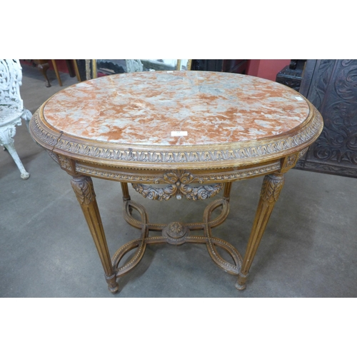 57 - A French Louis XV style carved wood and marble topped oval gueridon table