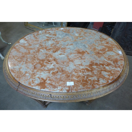 57 - A French Louis XV style carved wood and marble topped oval gueridon table