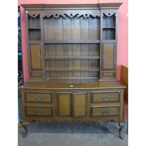 64 - A George II style inlaid oak dresser