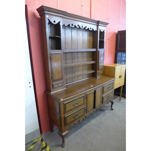 64 - A George II style inlaid oak dresser