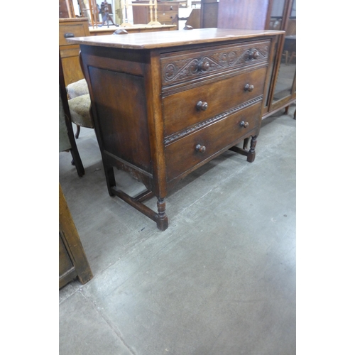 68 - A 17th Century style carved Ipswich oak chest of drawers