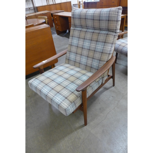 7 - A Guy Rogers teak New Yorker settee and pair of armchairs, designed by George Fejer and Eric Phamphi... 