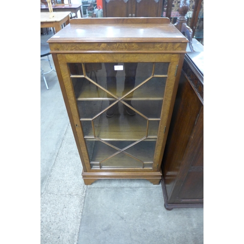 72 - A George I style burr walnut single door bookcase