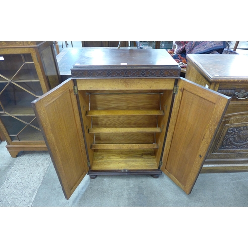 73 - An Edward VII oak fitted two door shoe cabinet