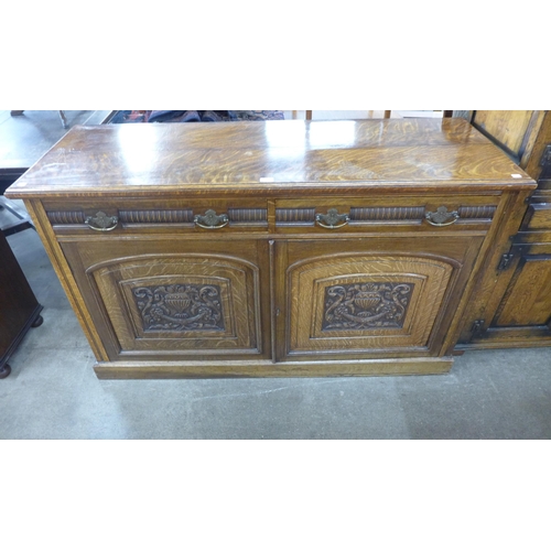 74 - A Victorian Aesthetic Movement carved oak sideboard