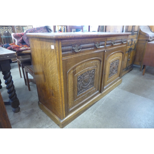 74 - A Victorian Aesthetic Movement carved oak sideboard