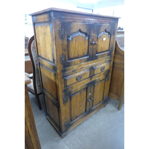 75 - An 18th Century style Ipswich oak livery cupboard