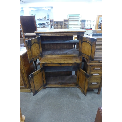 75 - An 18th Century style Ipswich oak livery cupboard