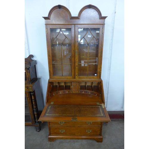 78 - A George I style burr elm bureau bookcase