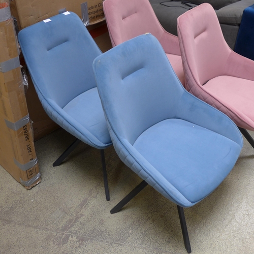 1530 - A pair of blue swivel dining chairs, one damaged * this lot is subject to VAT