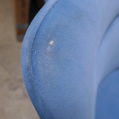 1530 - A pair of blue swivel dining chairs, one damaged * this lot is subject to VAT