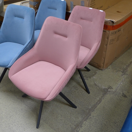 1531 - A pair of pink swivel dining chairs * this lot is subject to VAT