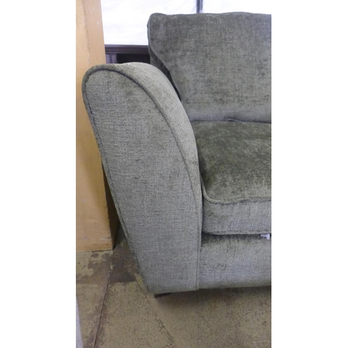 1573 - A moss green upholstered armchair