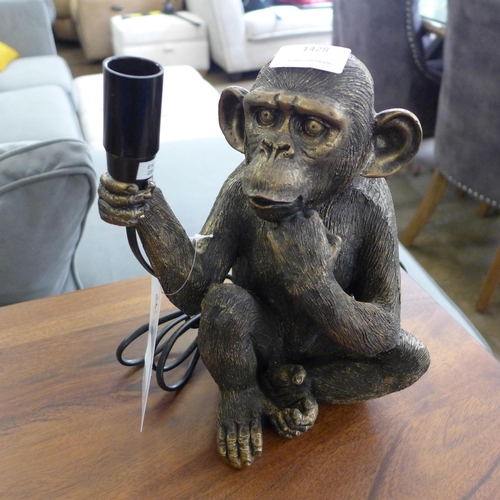 1428 - A monkey holding a bulb table lamp, H 23cms (3148821)   #