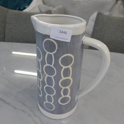 1446 - A large grey ceramic Emilie jug with circle print decoration  H26cms (7HM22312)   *