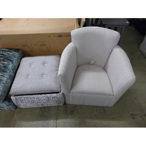 1569 - A beige upholstered storage side chair and ottoman footstool