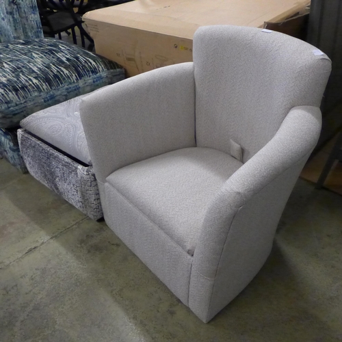 1569 - A beige upholstered storage side chair and ottoman footstool