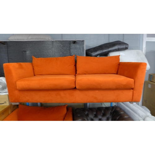 1494 - A tangerine velvet four seater and two seater sofa