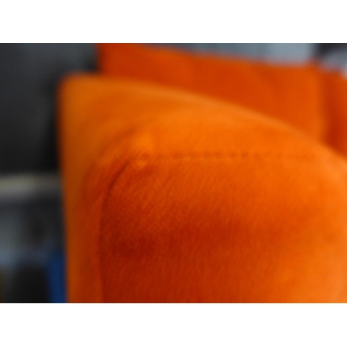 1494 - A tangerine velvet four seater and two seater sofa