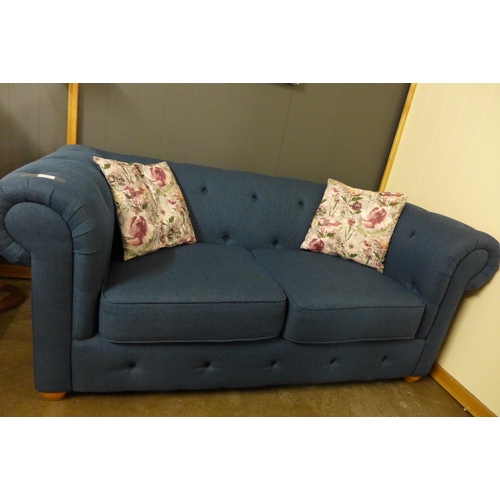 1356 - A navy blue textured weave Chesterfield style three seater sofa and two seater sofa and with floral ... 