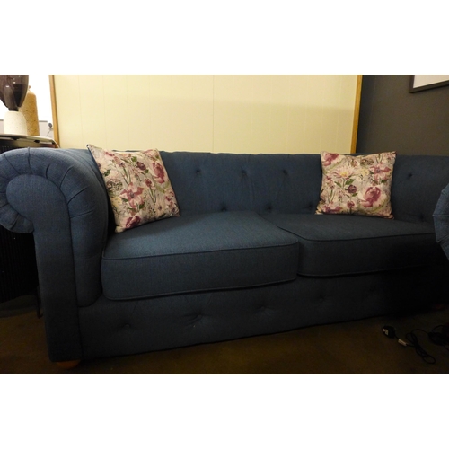 1356 - A navy blue textured weave Chesterfield style three seater sofa and two seater sofa and with floral ... 